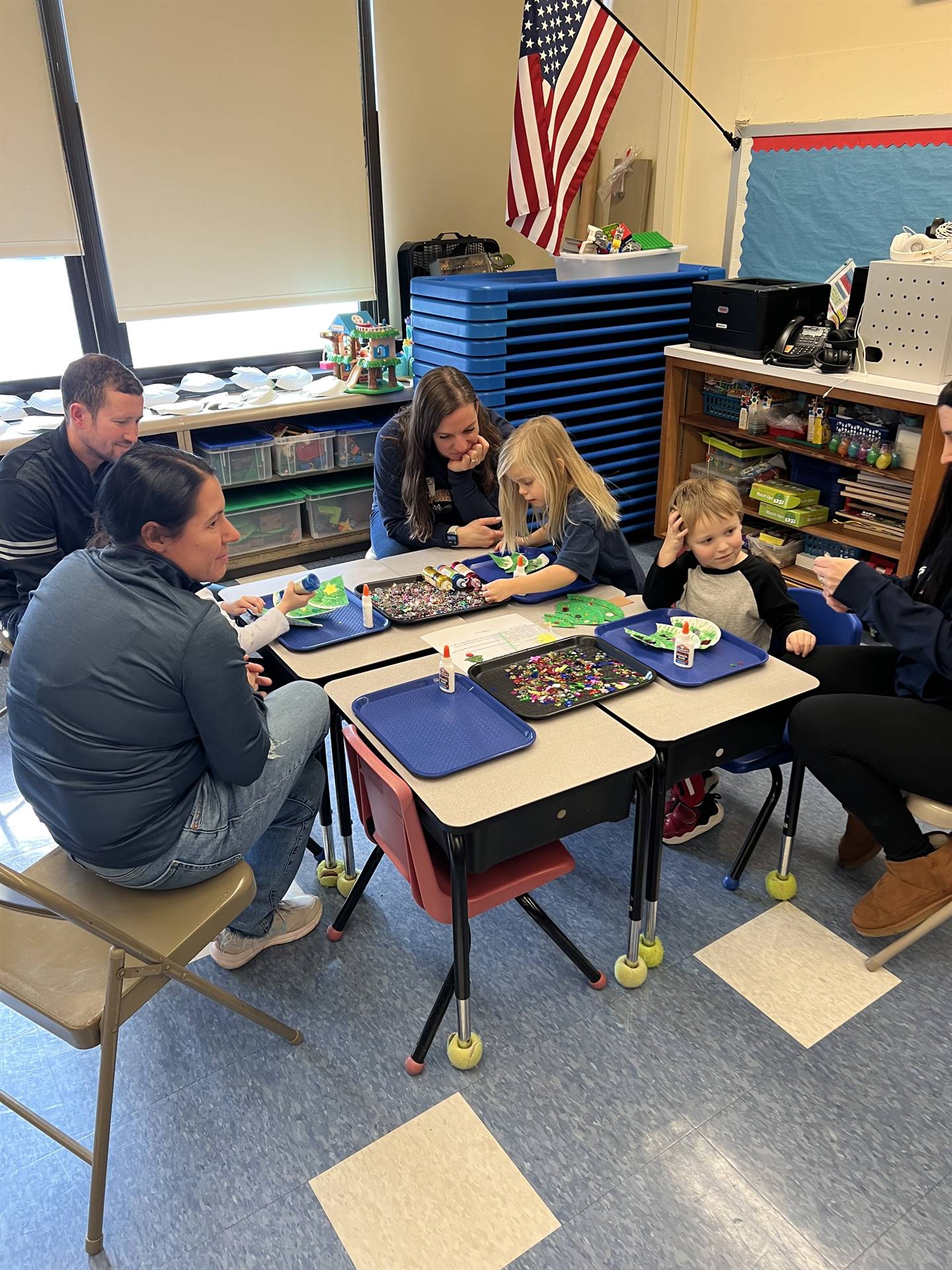 adults and students crafting together