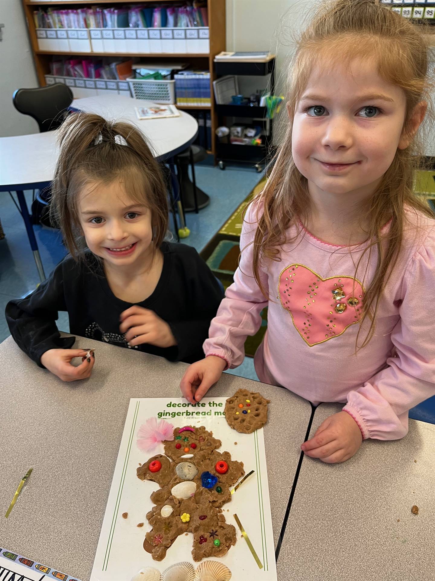 2 students worked together to create a play do ginger bread friend.