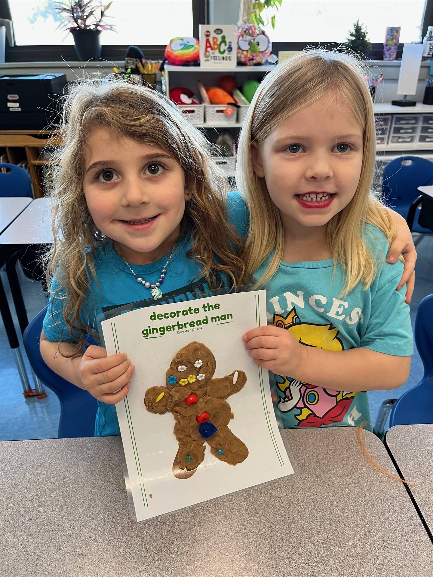 2 students worked together to create a play do ginger bread friend.