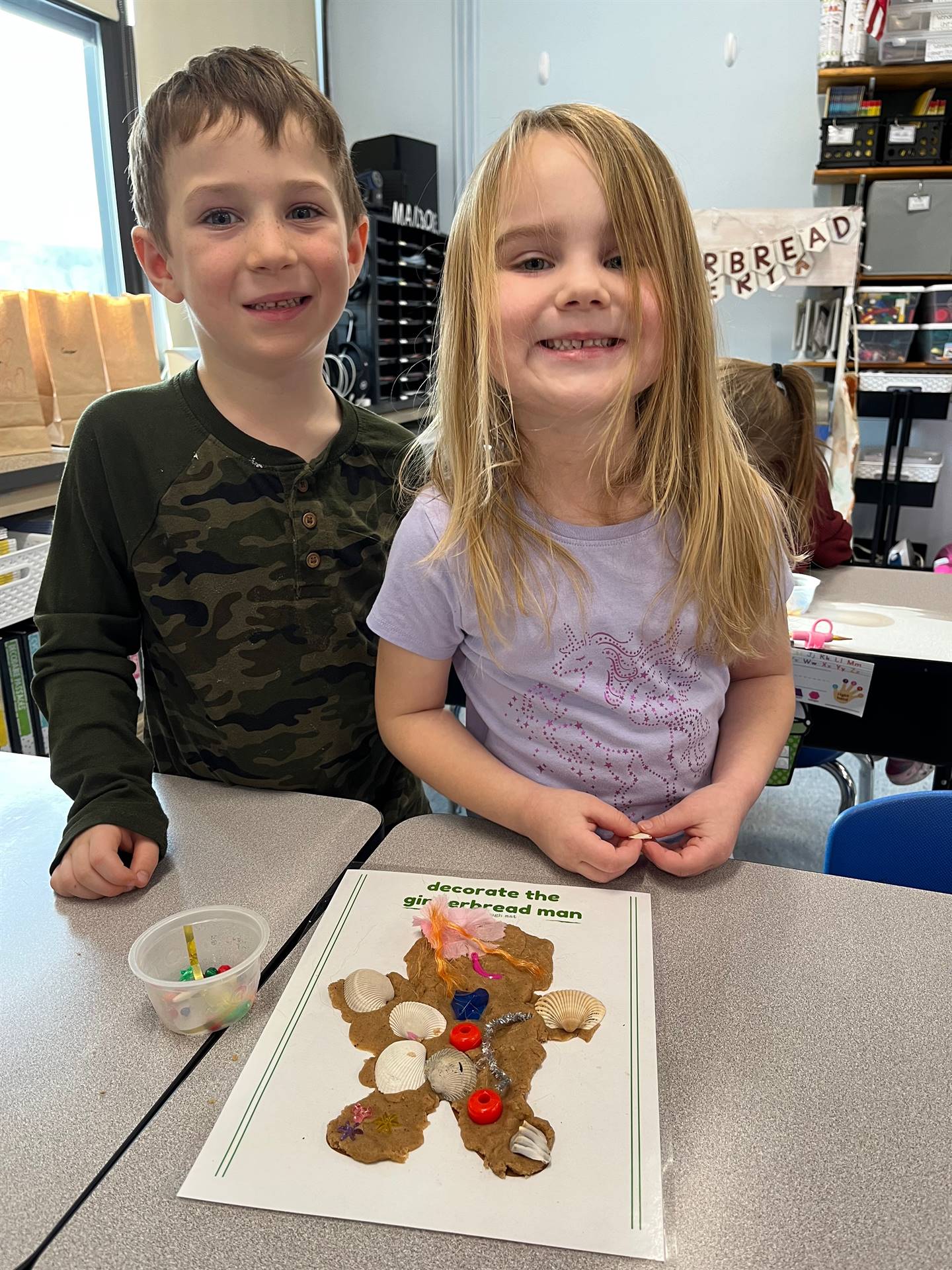 2 students worked together to create a play do ginger bread friend.