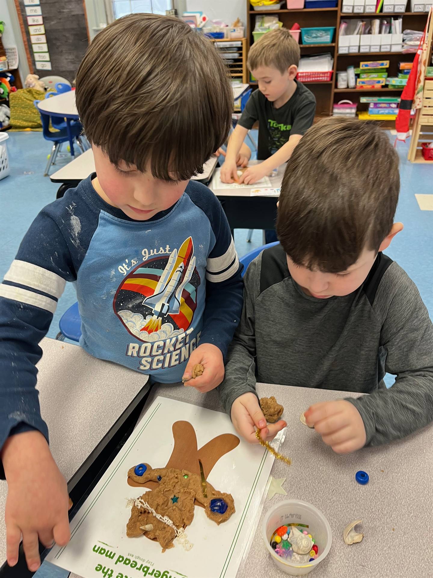 2 students worked together to create a play do ginger bread friend.