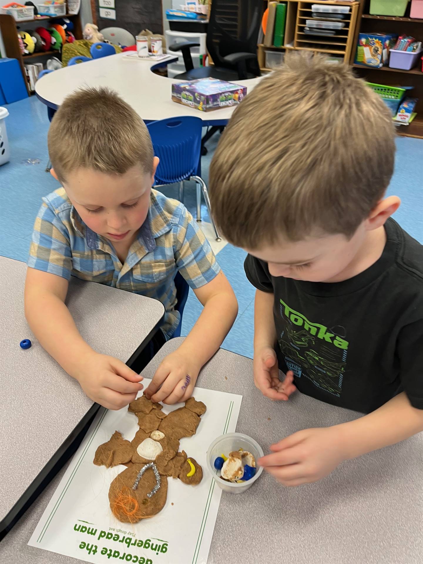 2 students worked together to create a play do ginger bread friend.