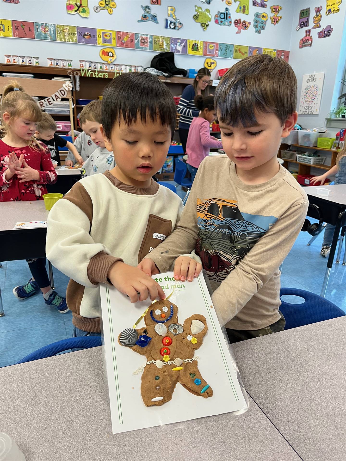2 students worked together to create a play do ginger bread friend.