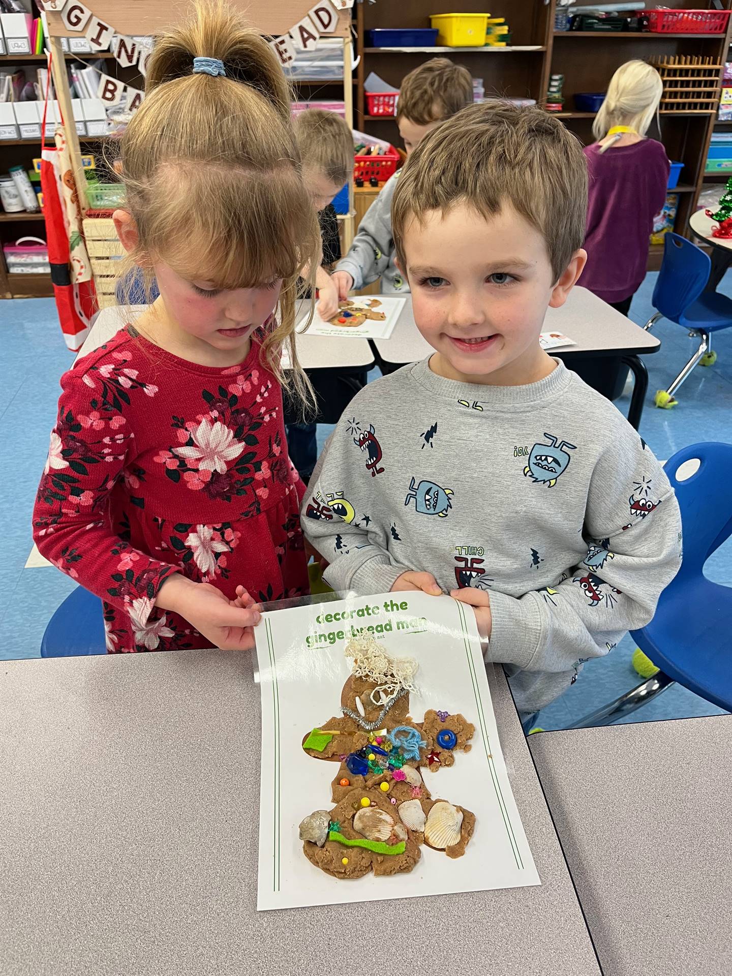 2 students worked together to create a play do ginger bread friend.