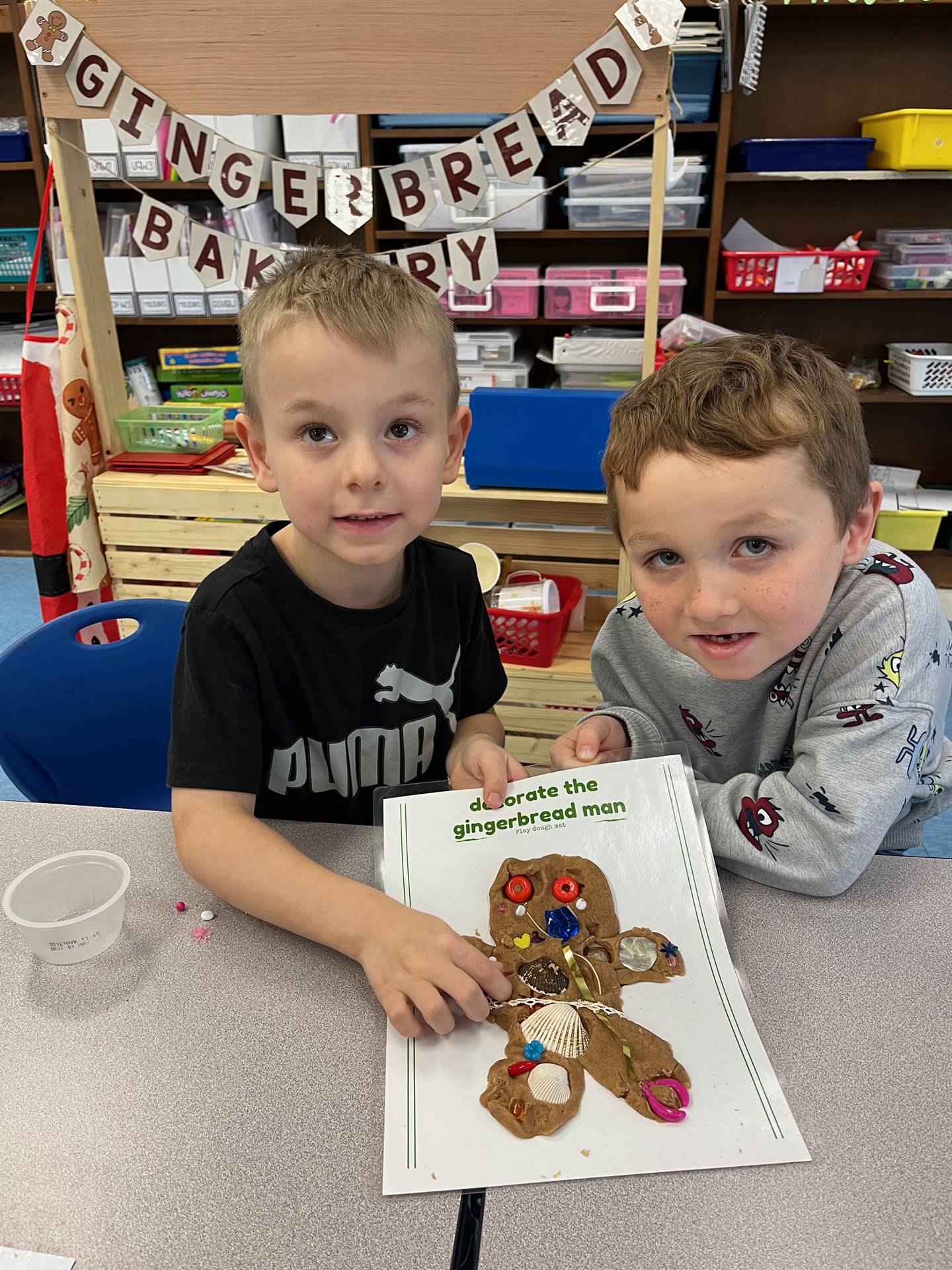 2 students worked together to create a play do ginger bread friend.