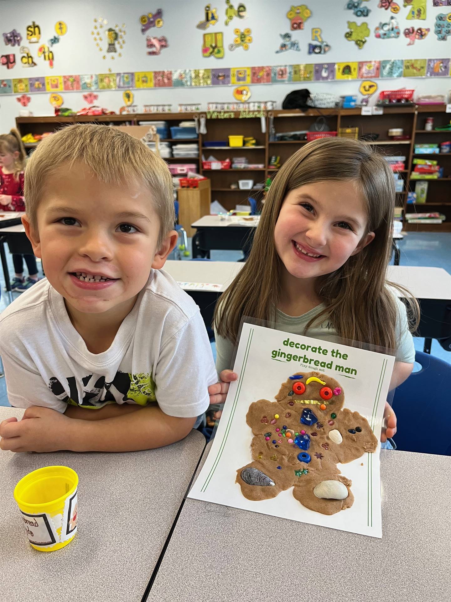 2 students worked together to create a play do ginger bread friend.
