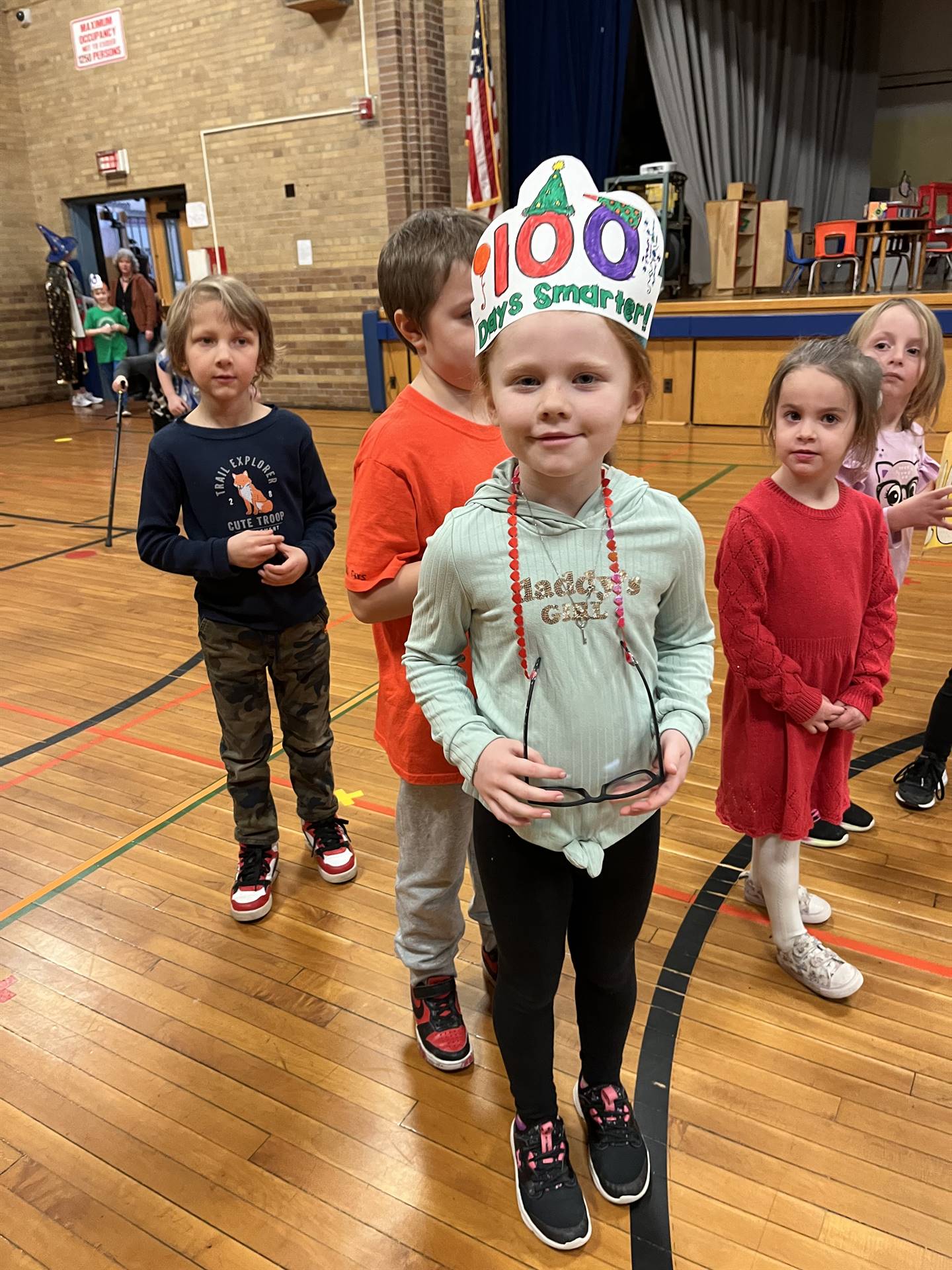 2 students dressed up as 100 yrs. old with 100 crown.