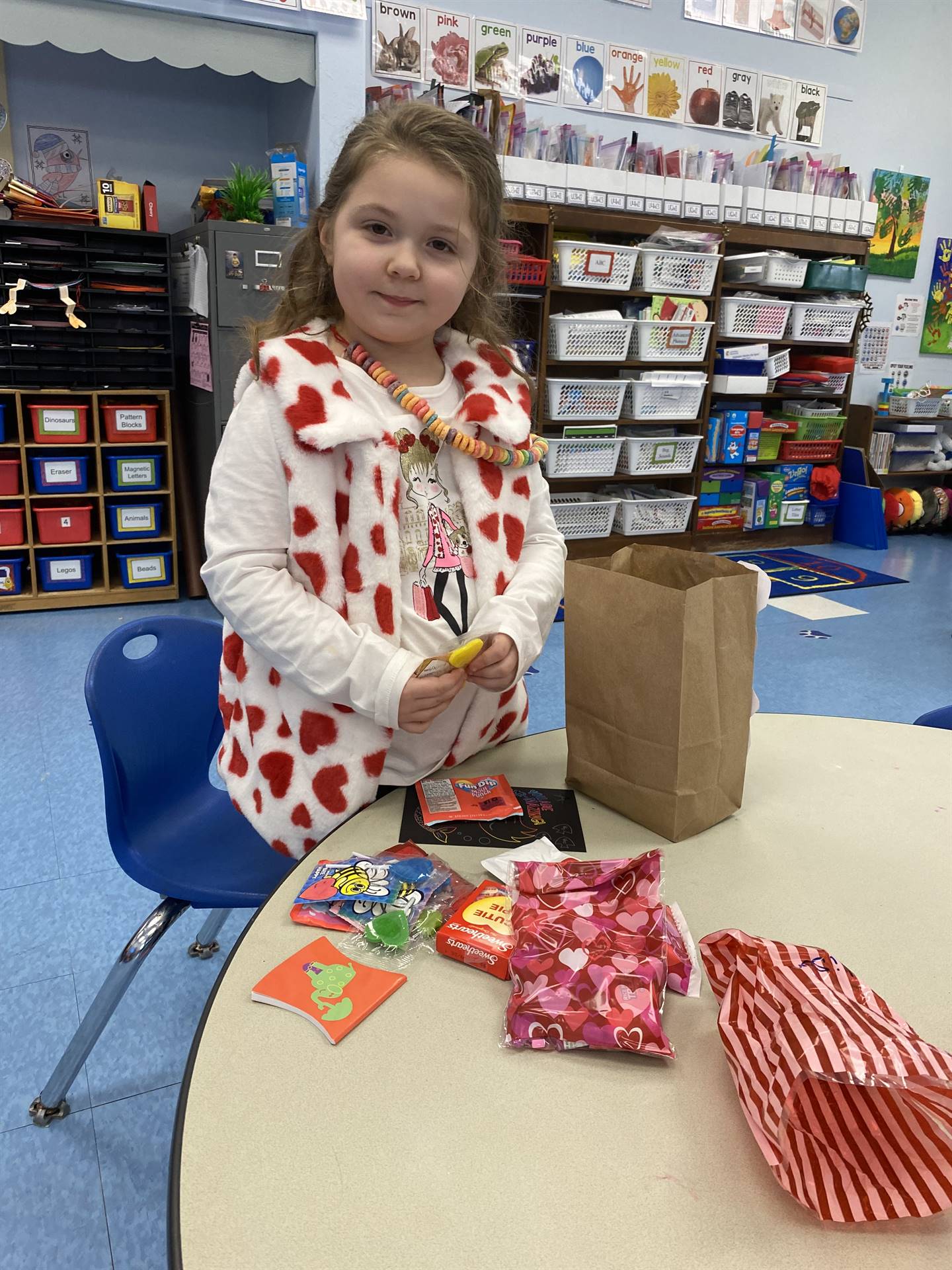 a student goes through all her valentines with a  smile