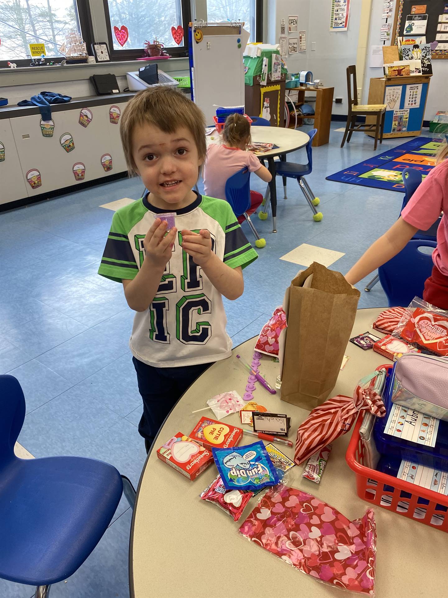 a student holds up a special valentine