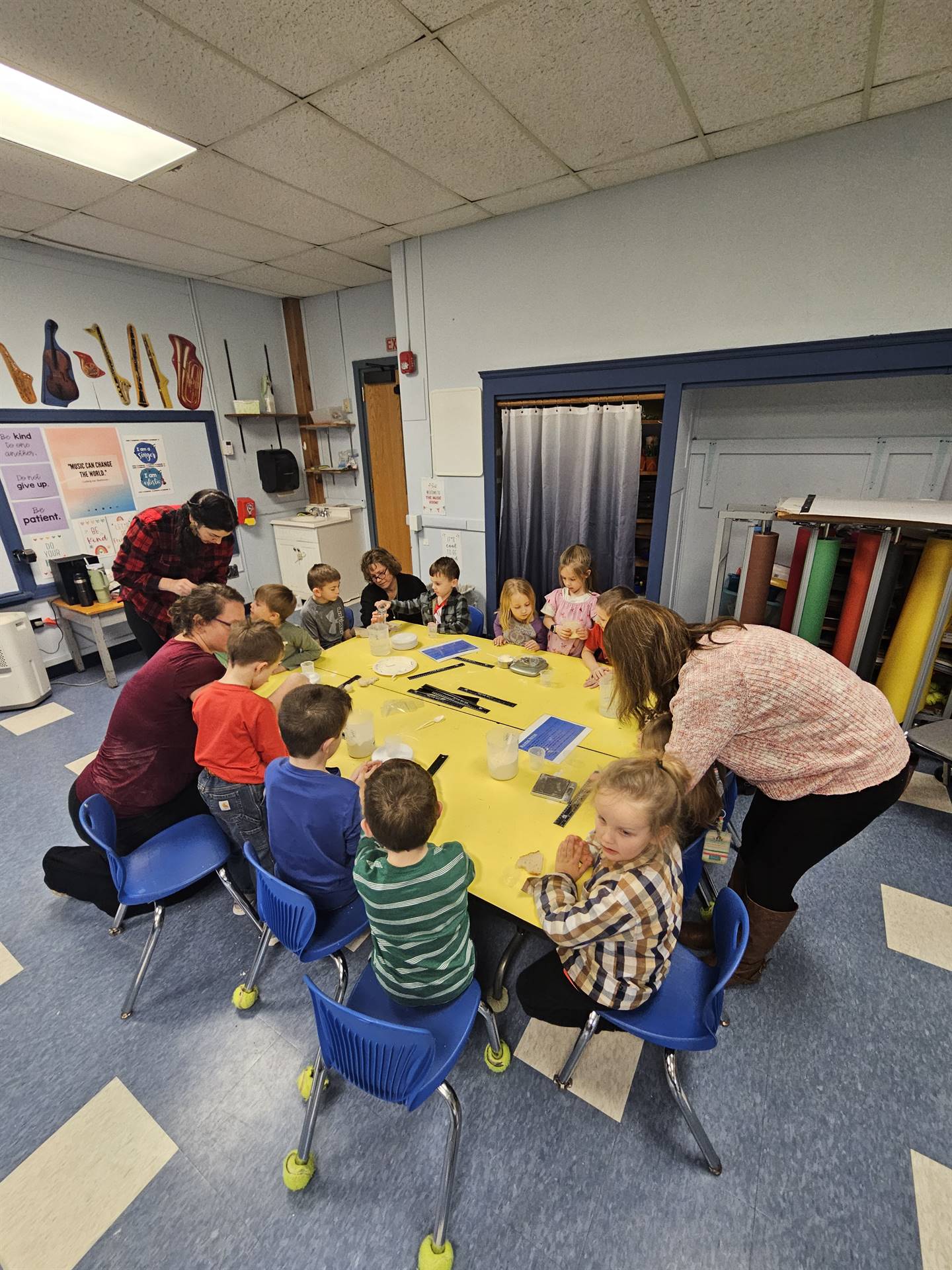 students are shown how to add flour and water to a bag.