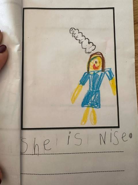 a picture of a girl dressed in blue