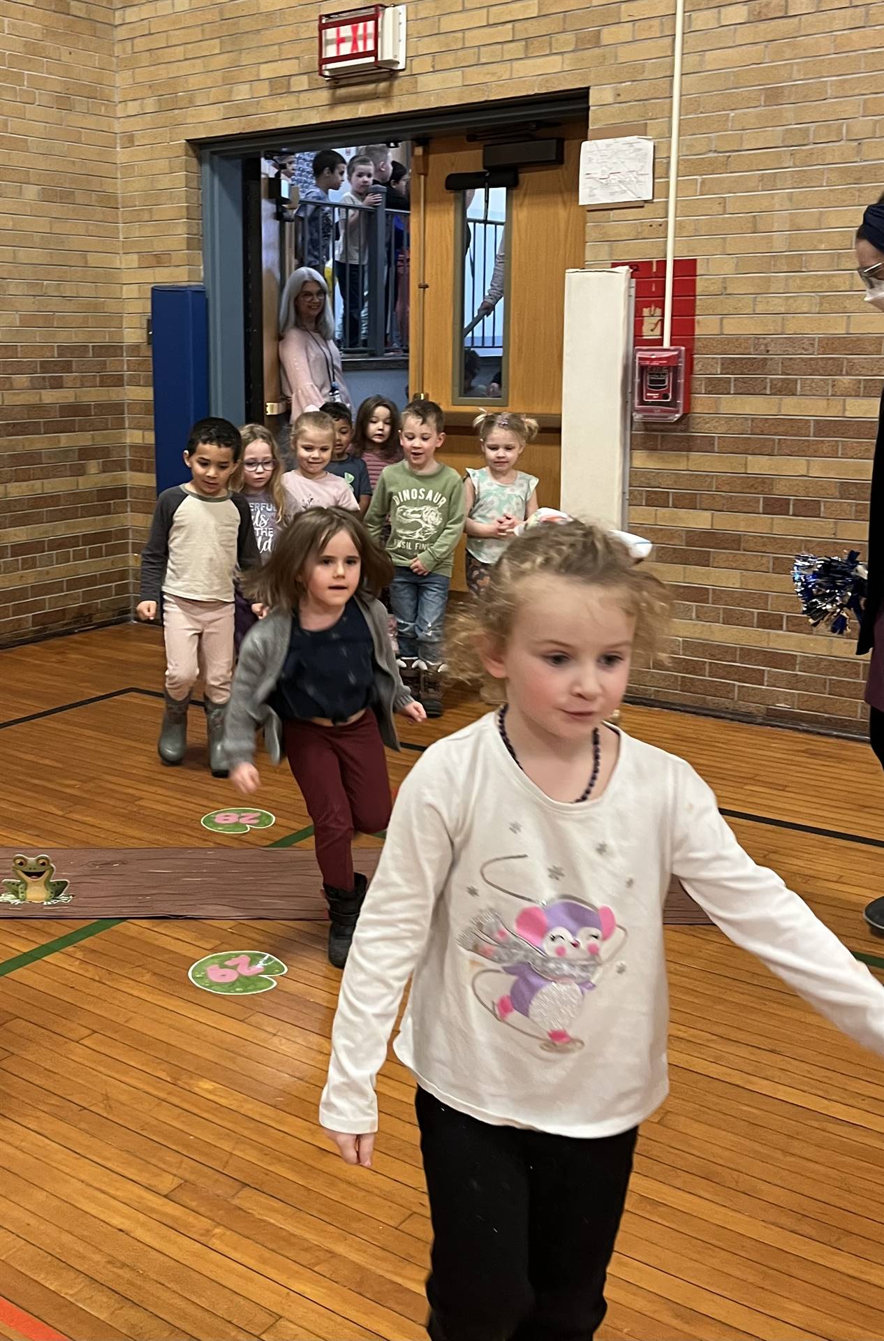 students entering a gym