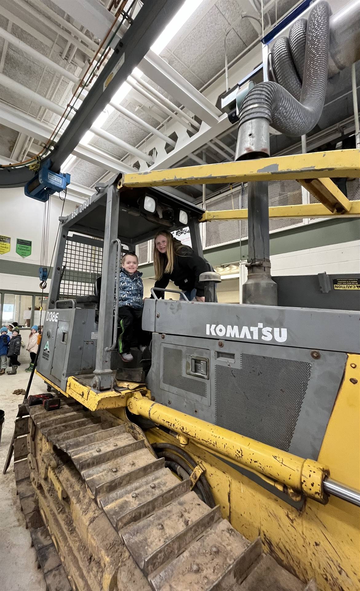 student on large digger