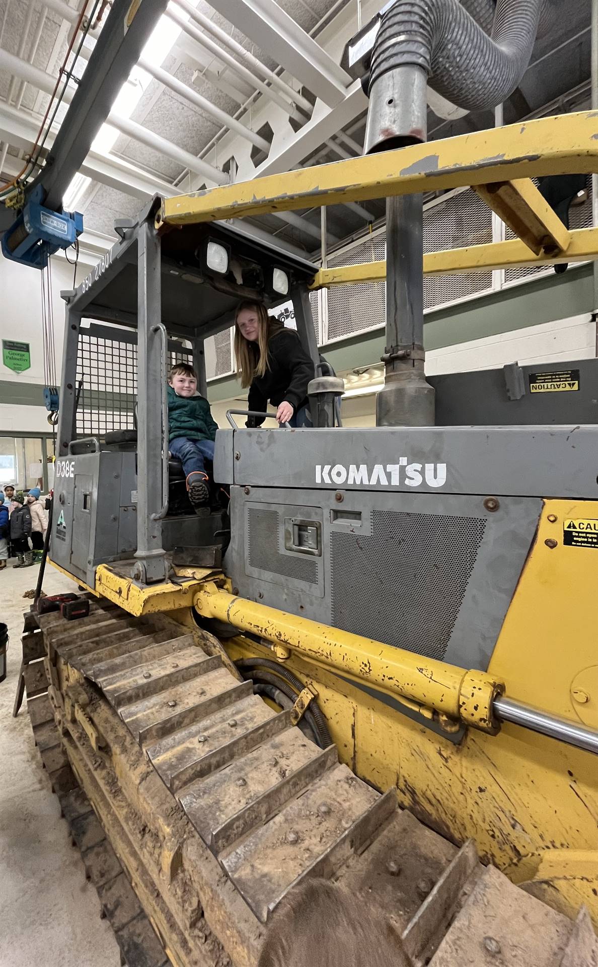 student on large digger