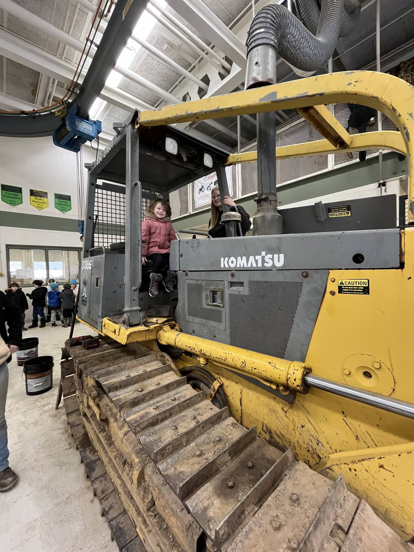 student on large digger