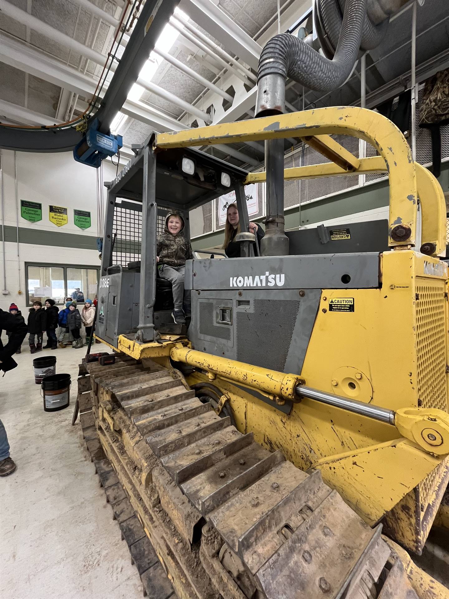 student on large digger