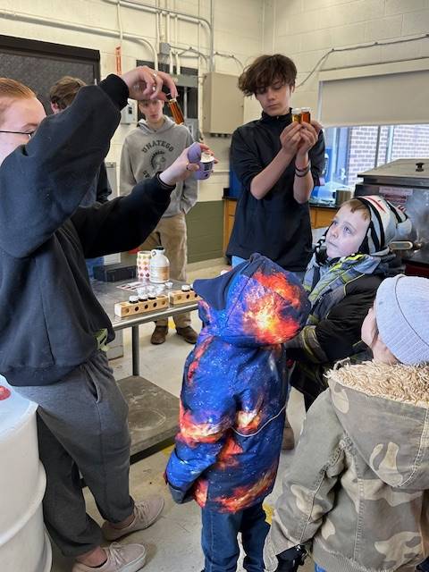 students listening to a maple syrup presentation.