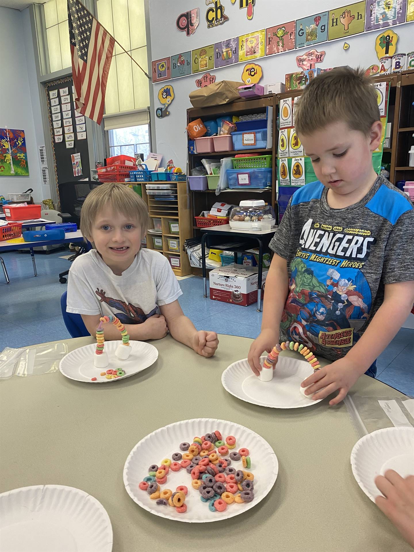 students use fruit loops to create a rainbow.