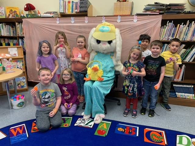 The Easter Bunny surrounded by a class