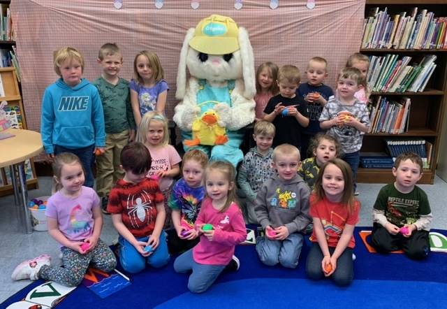 The Easter Bunny surrounded by a class