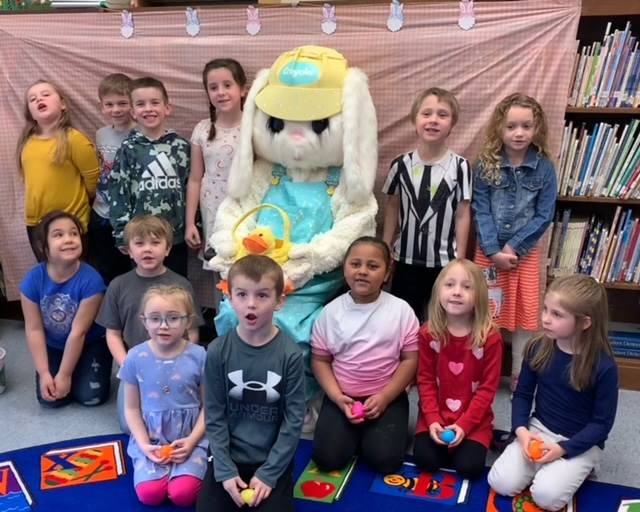 The Easter Bunny surrounded by a class