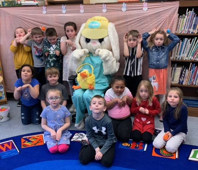 The Easter Bunny surrounded by a class