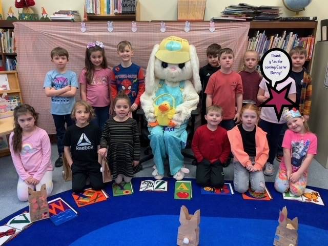 The Easter Bunny surrounded by a class