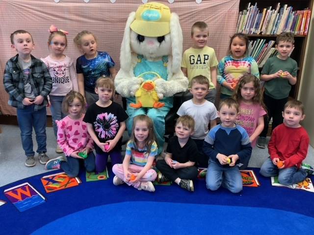 The Easter Bunny surrounded by a class