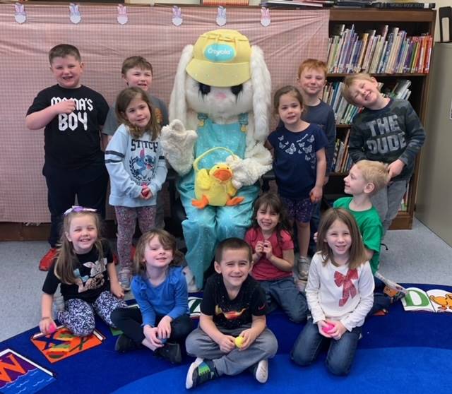 The Easter Bunny surrounded by a class