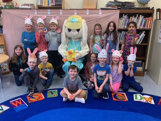 The Easter Bunny surrounded by a class