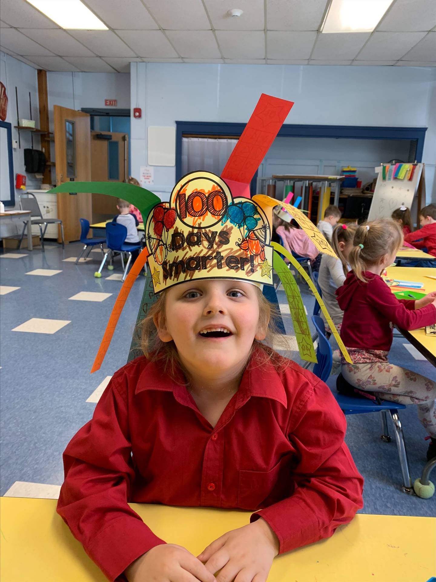 student has on 100 days hat