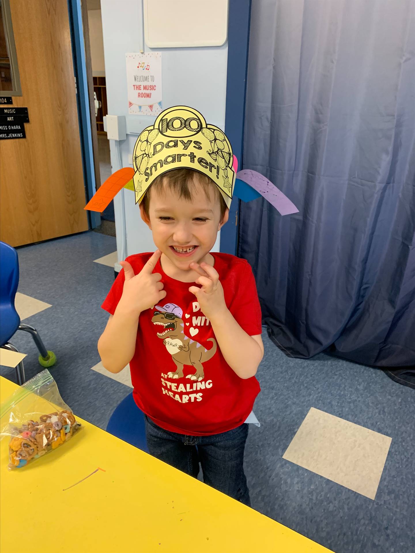 student has on 100 days hat