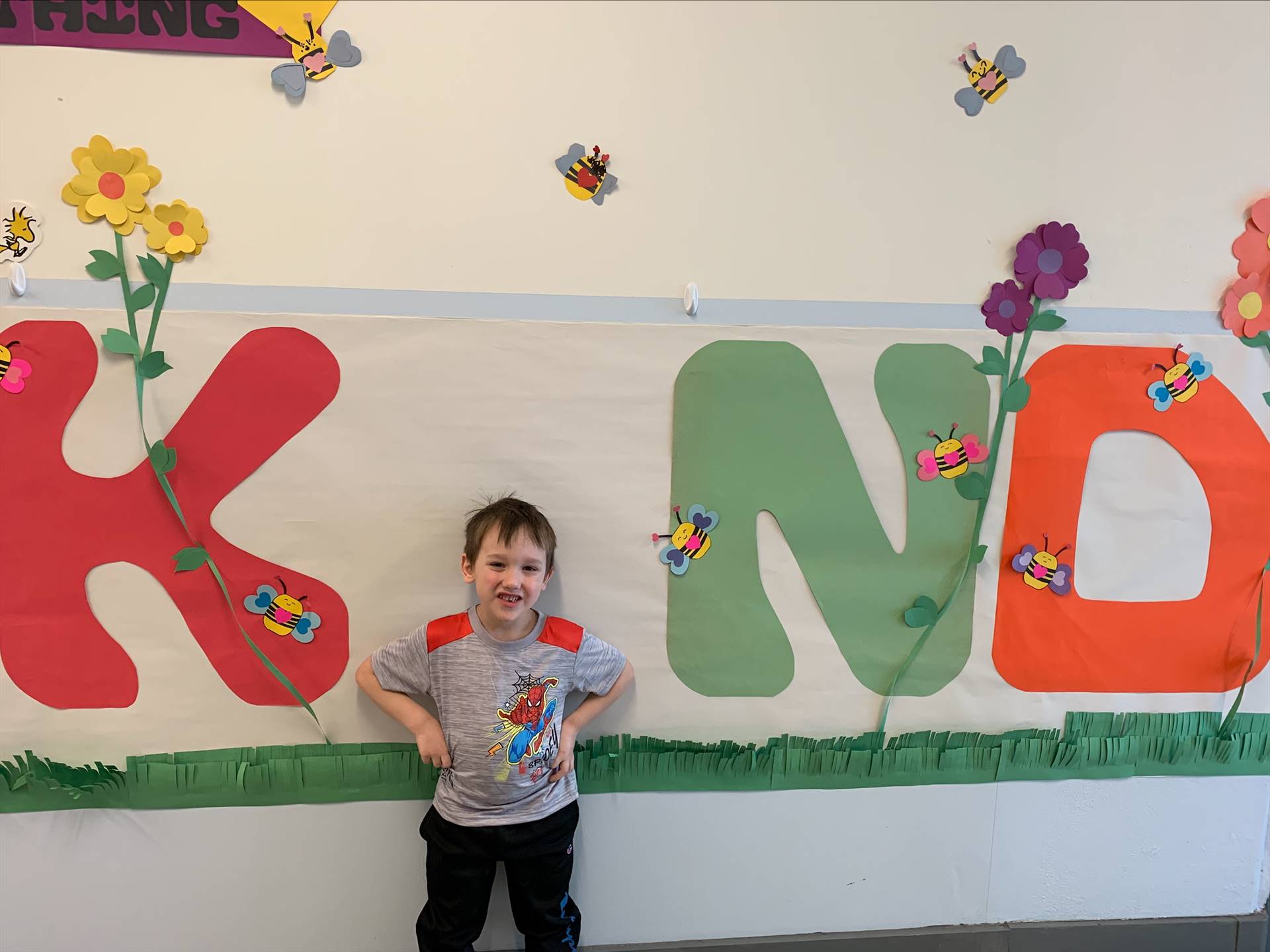 student is "I" in a large K I ND poster