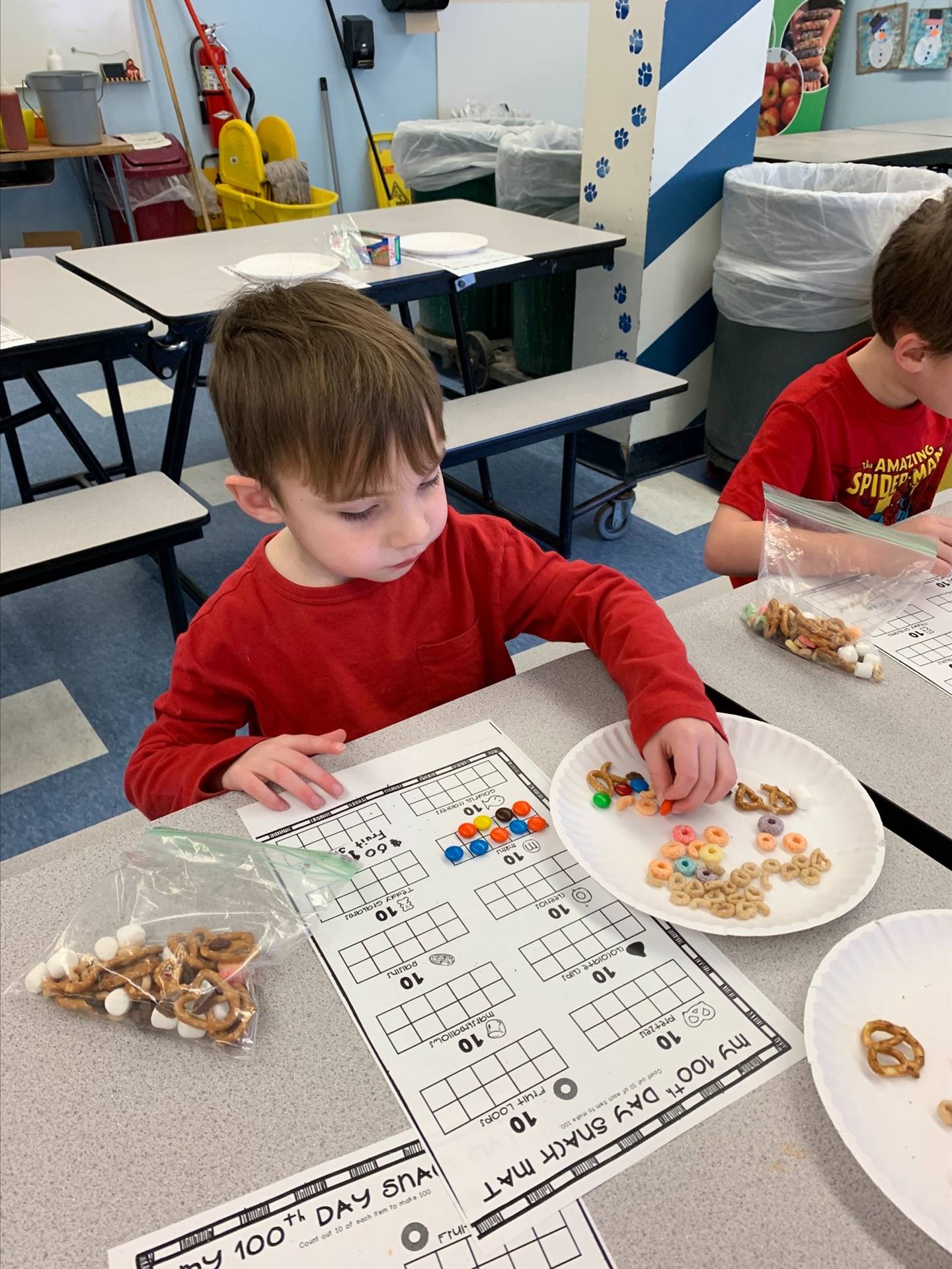 student uses graphs and food to count to 100.