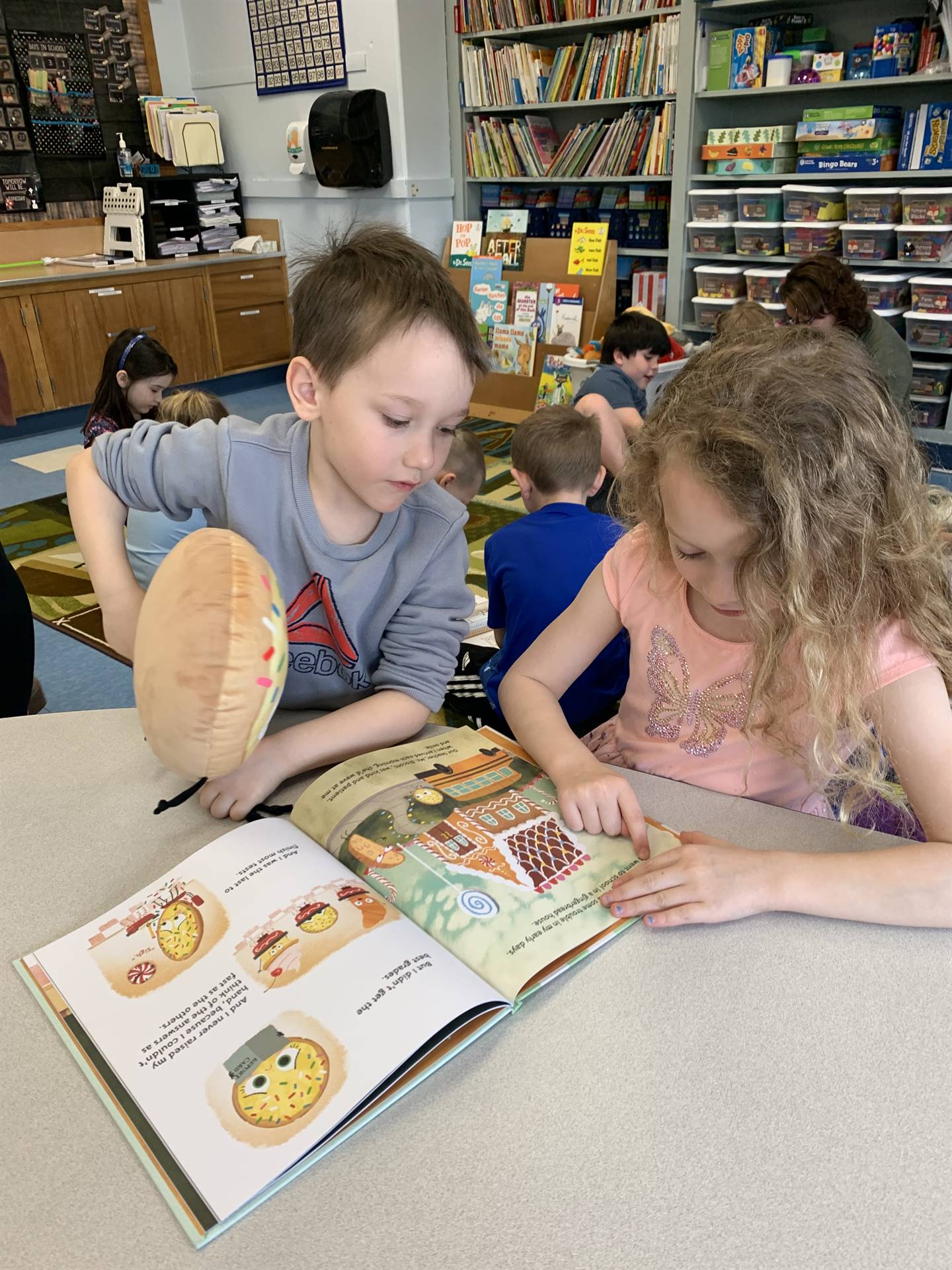 2 students reading books together