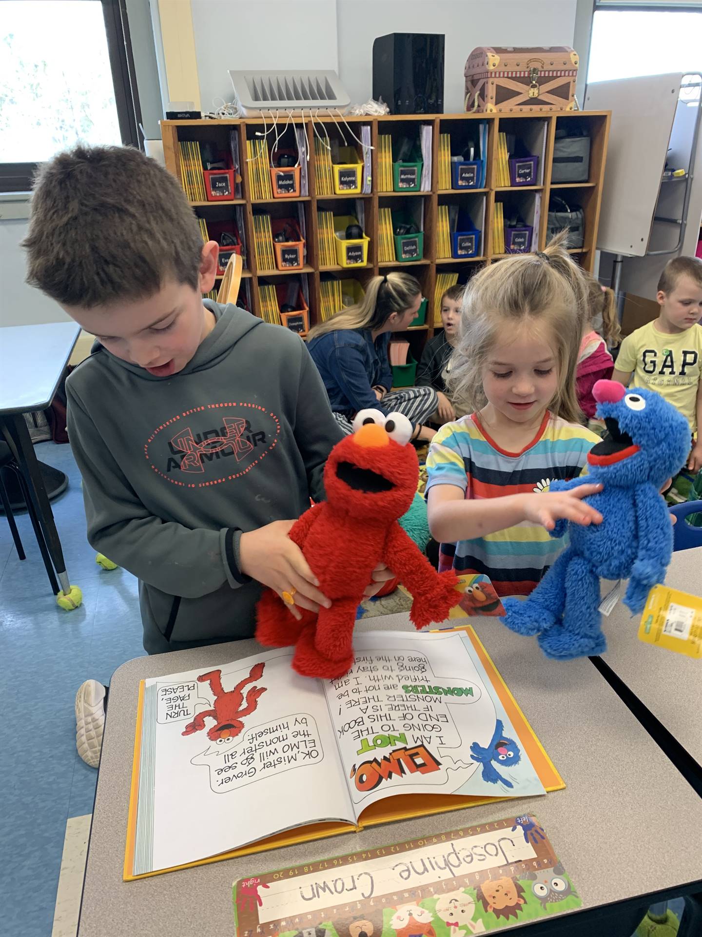 2 students reading books together