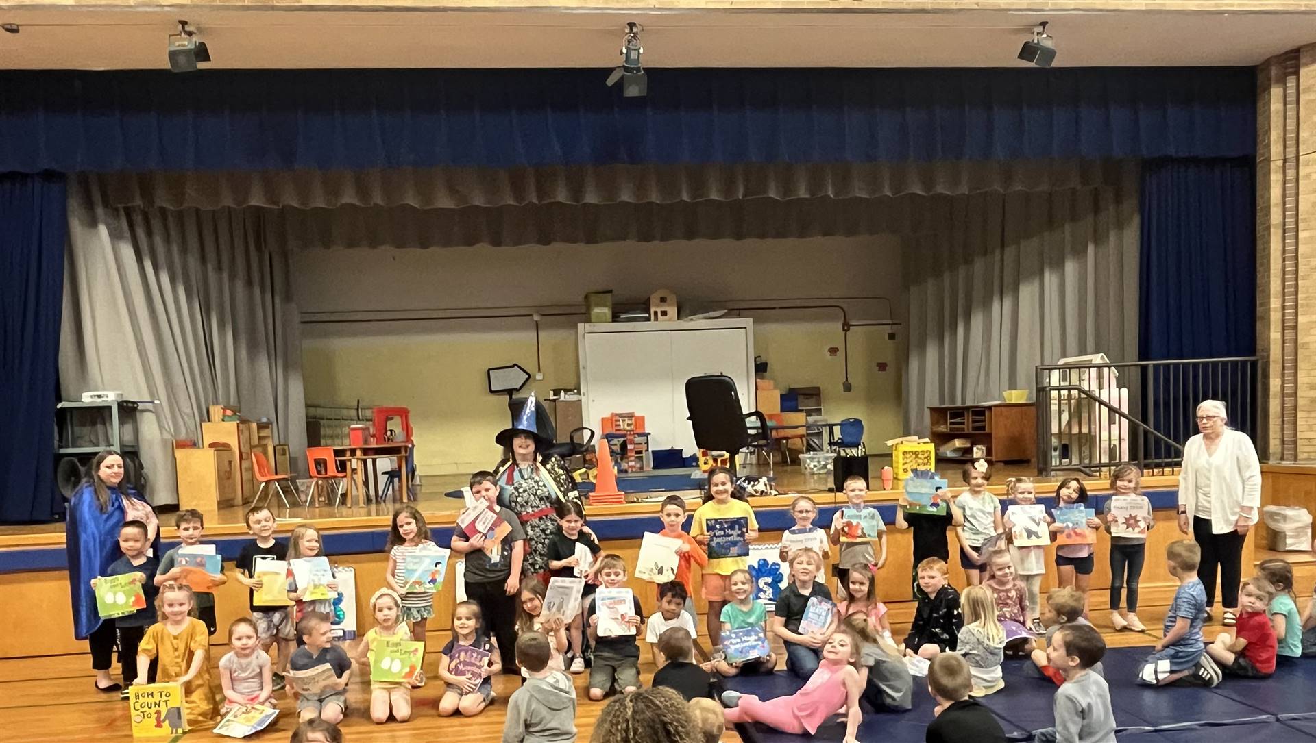 students with certificates and books.