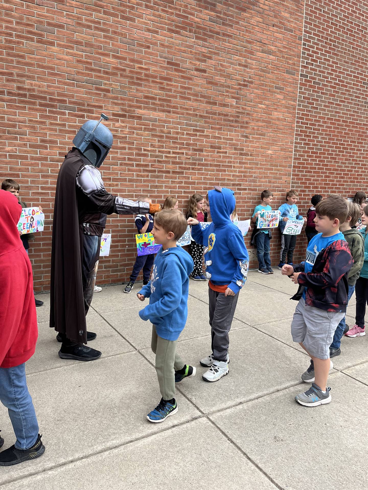 students being greeted by a star wars character