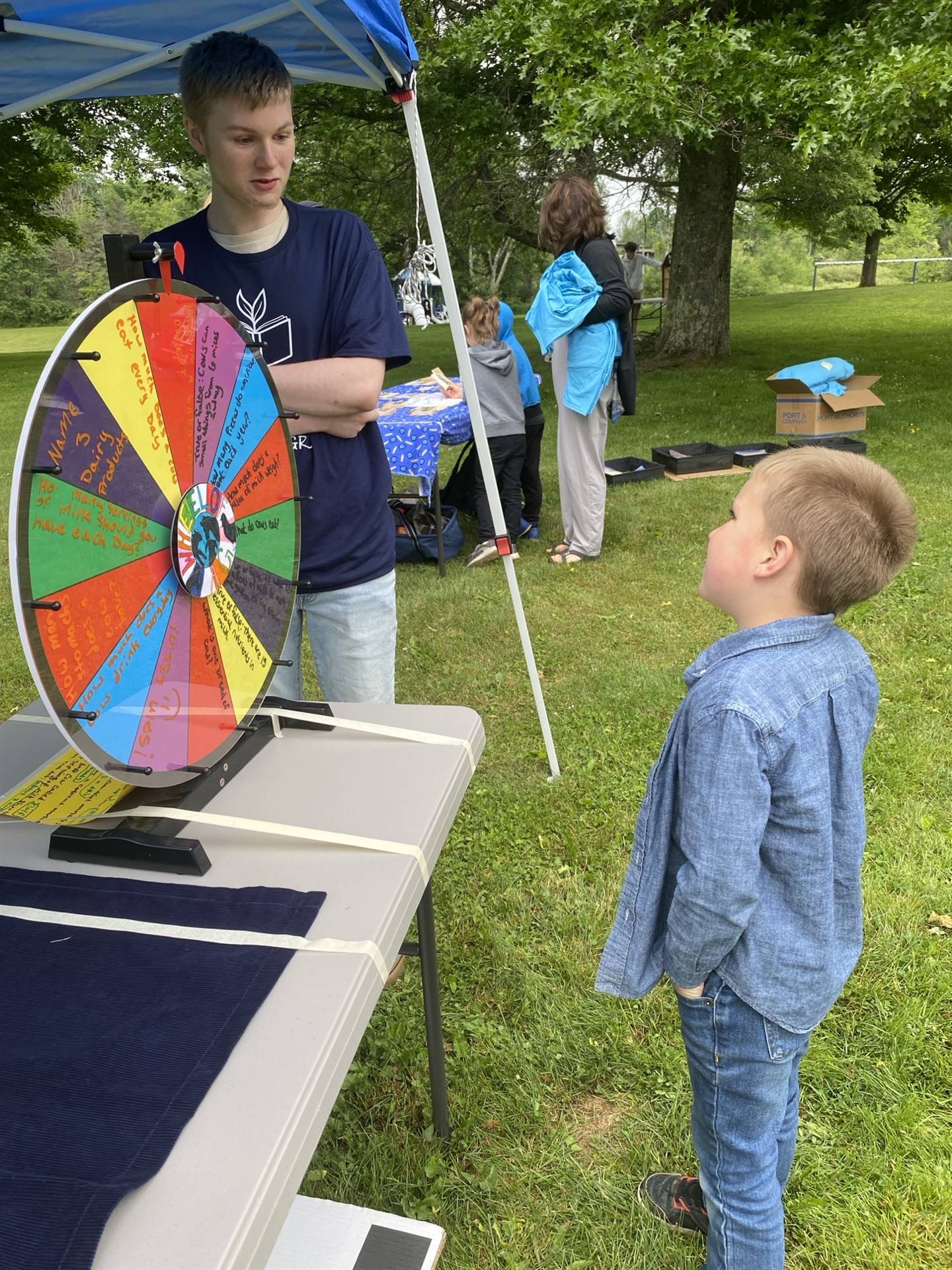 student getting ready to spin the game wheel.