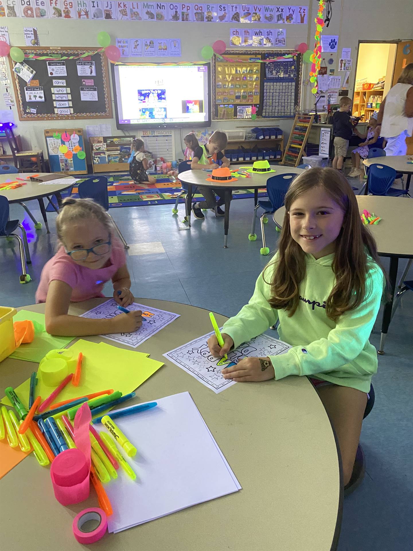 students doing crafts at a table
