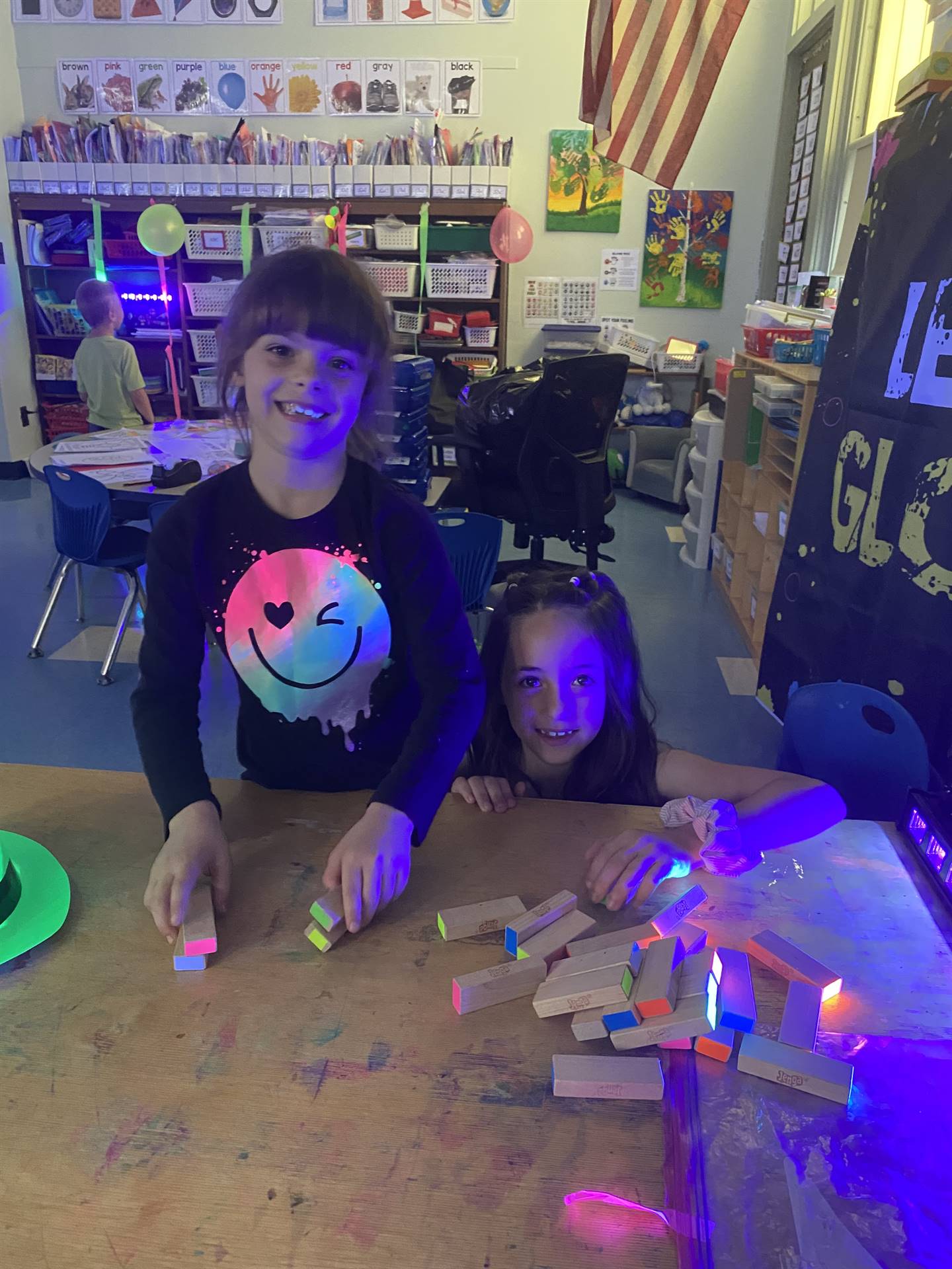 2 students with glow day outfits