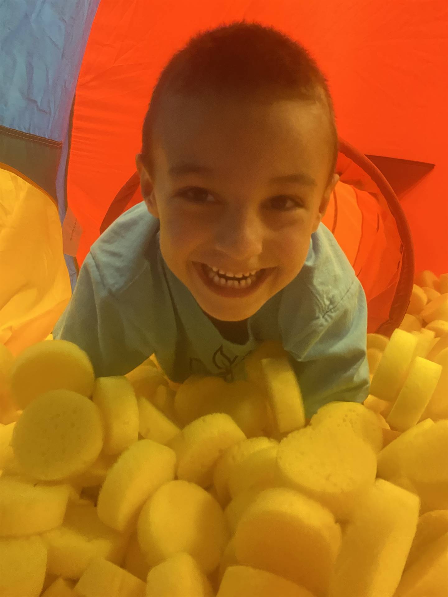 student in ball pit
