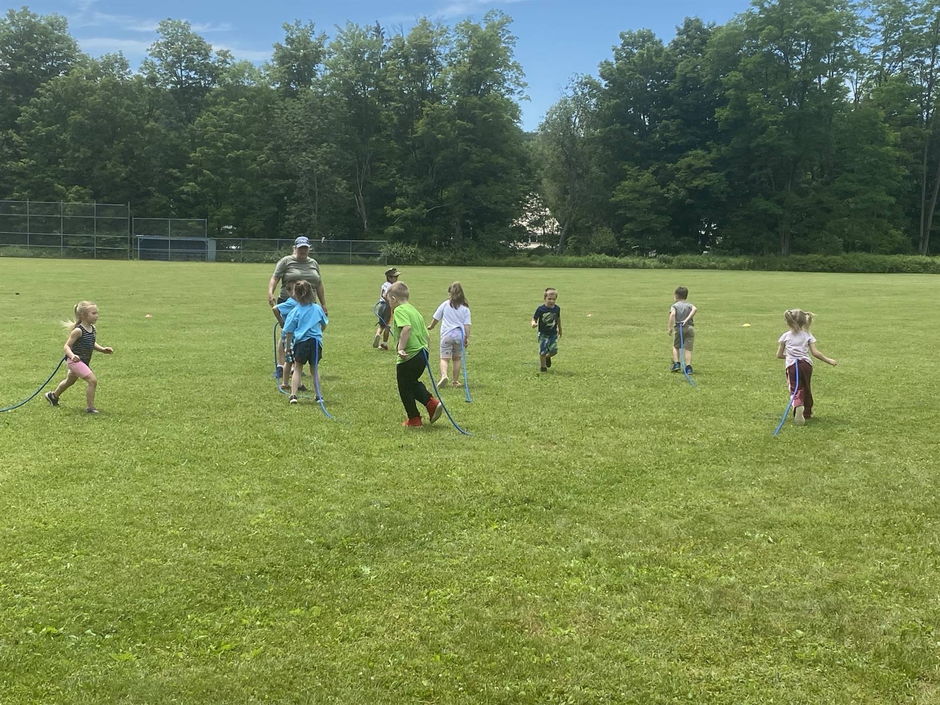 students running in a field.