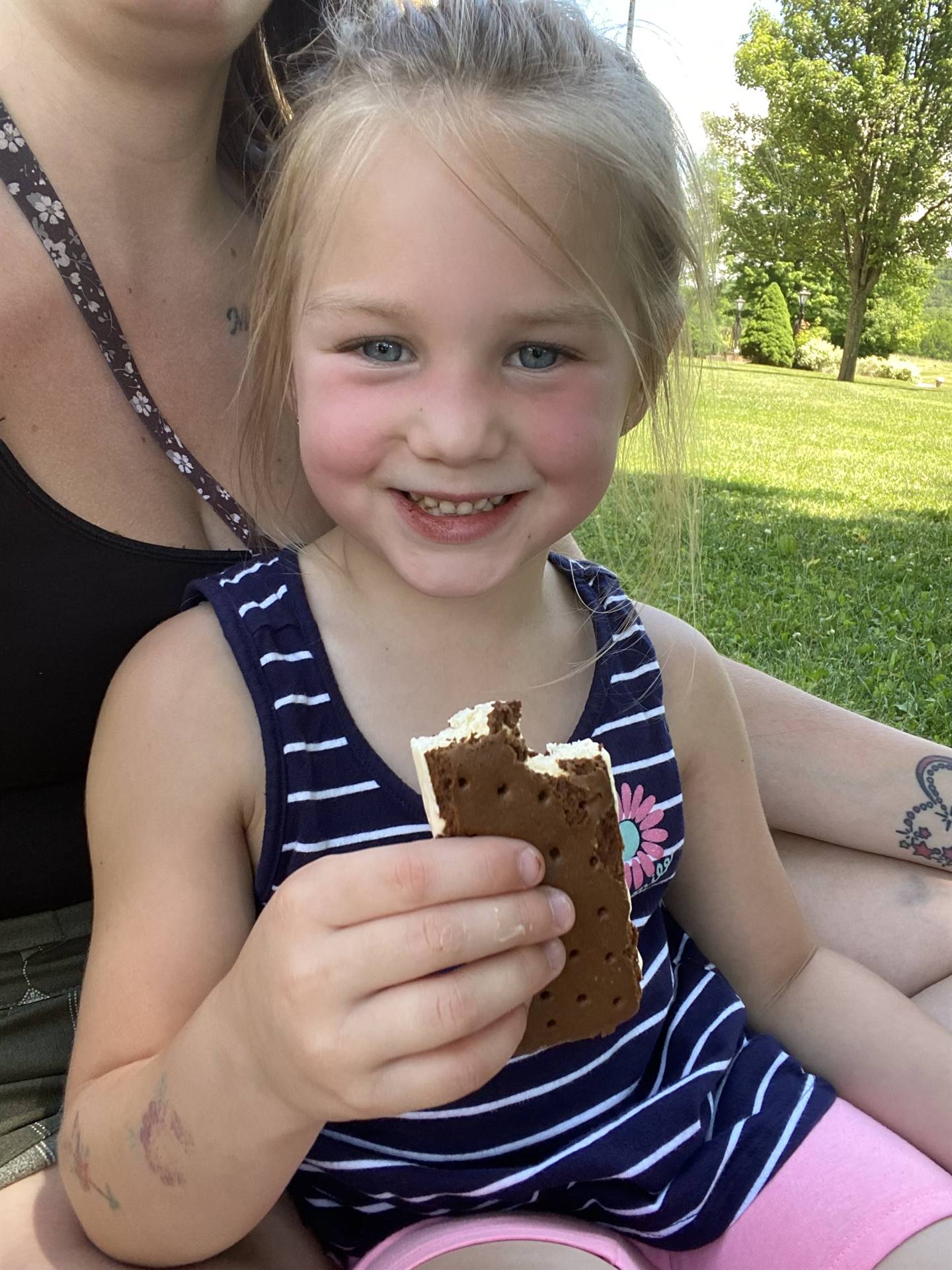 student with ice cream sandwich. 