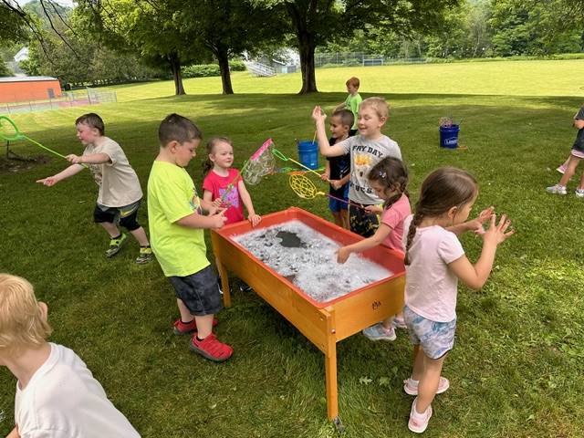 students at bubble table 