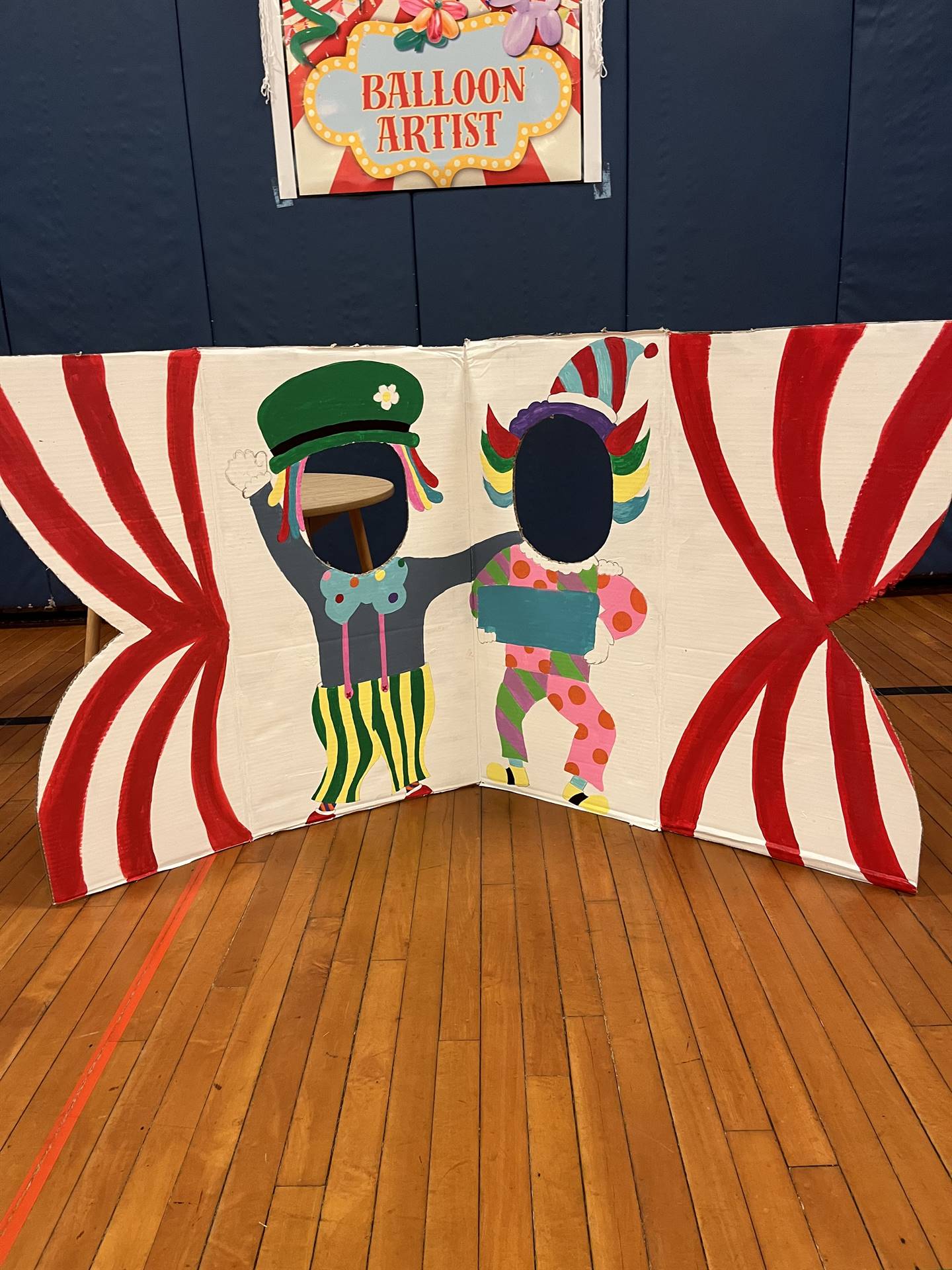 Painted photo booth of 2 clowns 