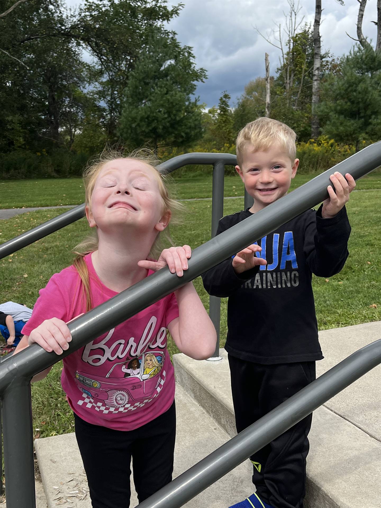 2 students standing outdoors