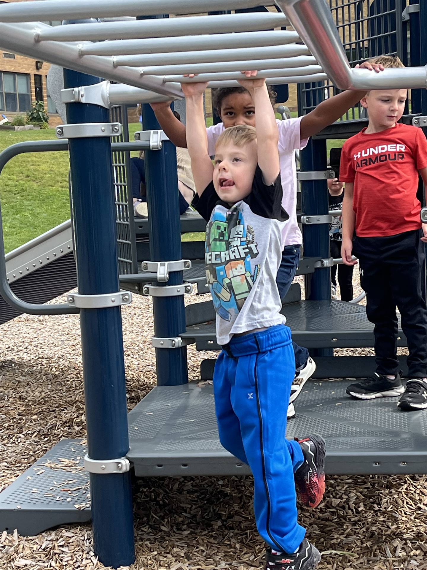 student on monkey bars