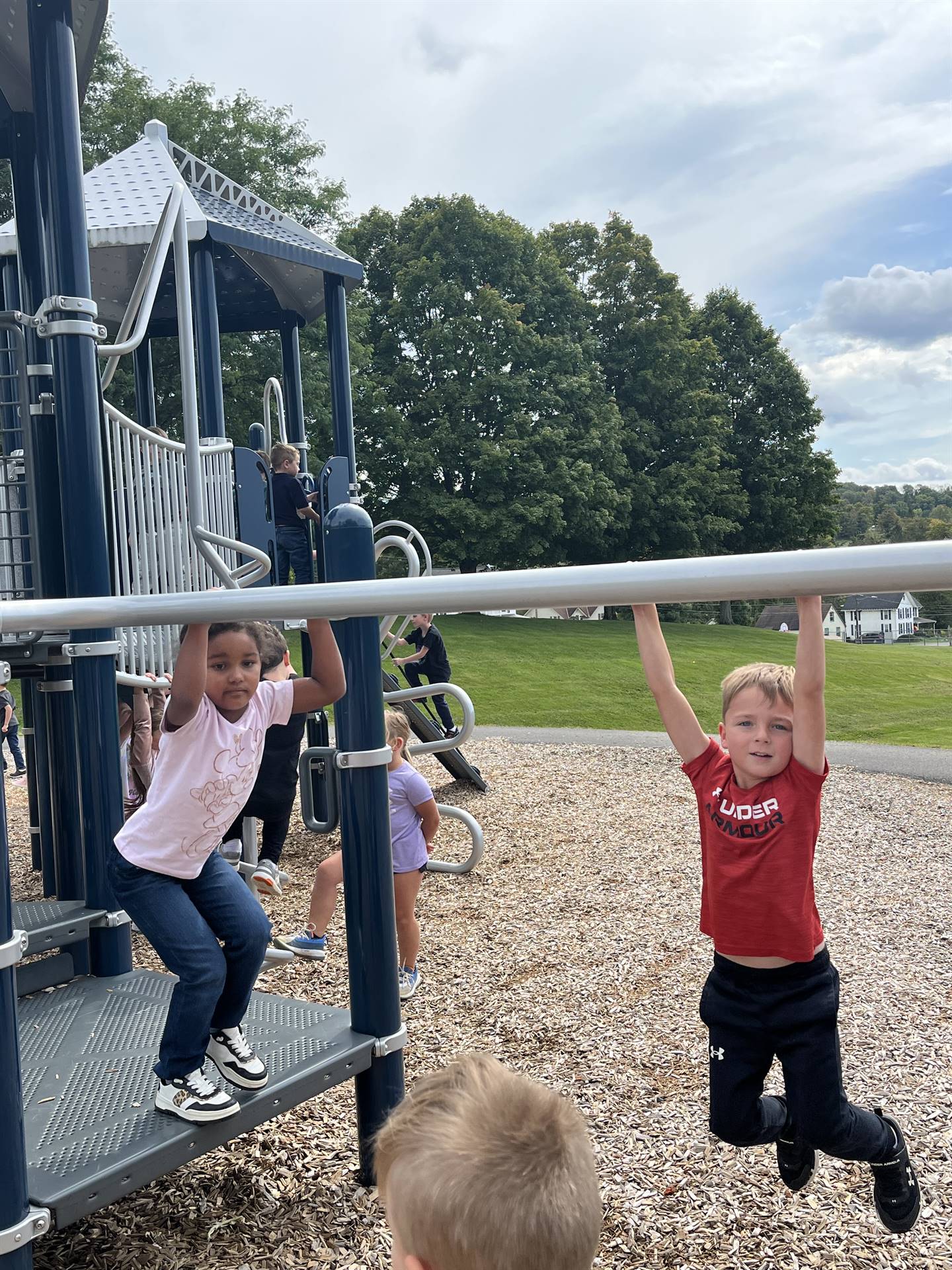 student on monkey bars