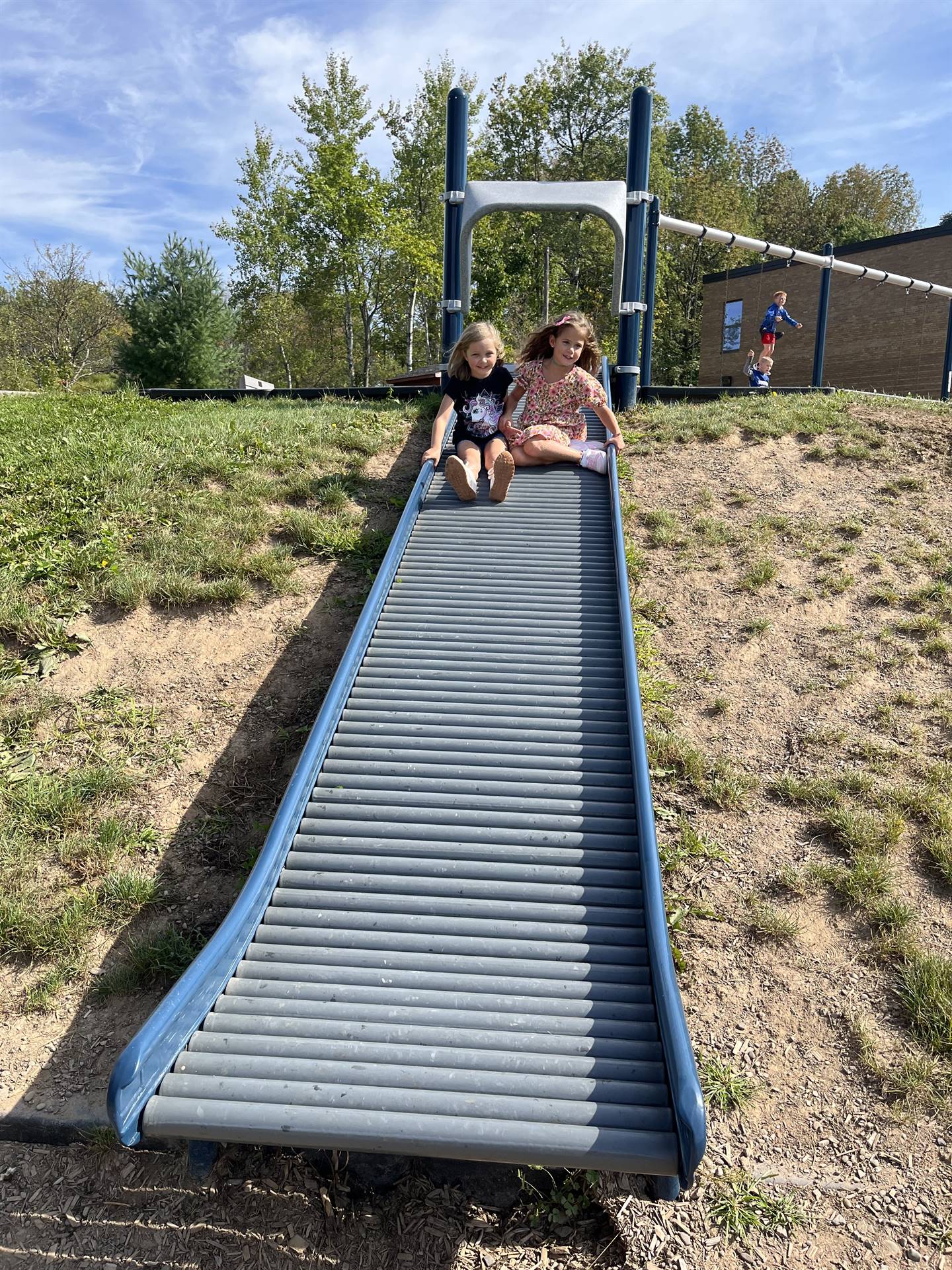 2 students on slide.